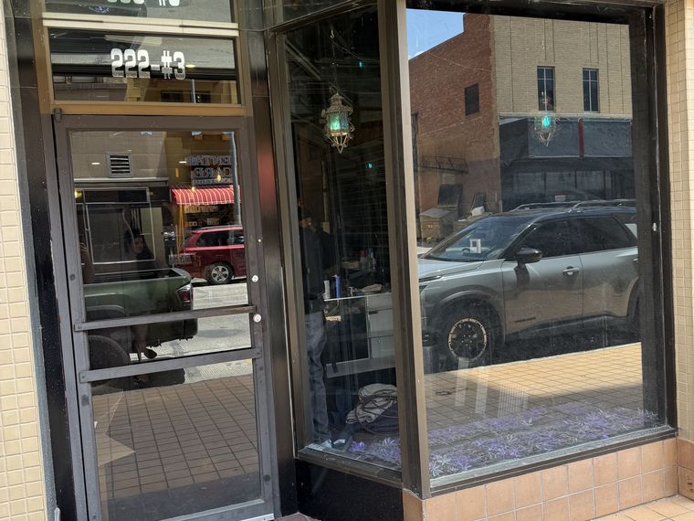 Full-height solar film on street-facing storefront glass in downtown El Paso — PMT Tint