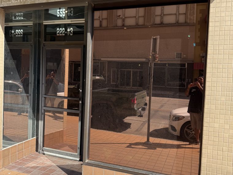 Bronze solar film on a new downtown El Paso smoke shop storefront — PMT Tint
