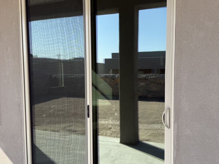 Ceramic film on a residential sliding glass door in El Paso — PMT Tint